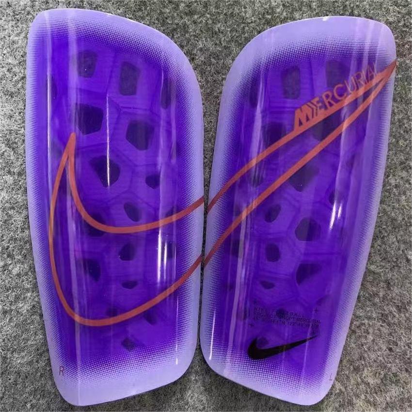 Caneleira Nike